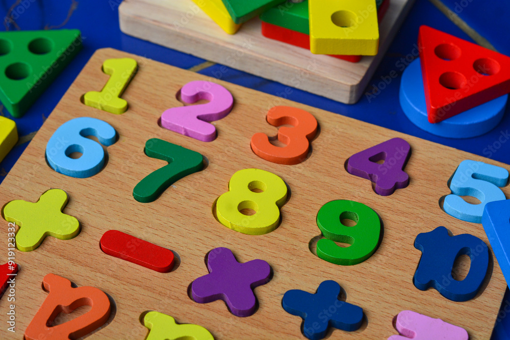Set of different children's toys on a colored background top view. A place to insert text, minimalism. Baby background. Set of different children's toys on a colored background top view. A place to insert text, minimalism. Baby background.
