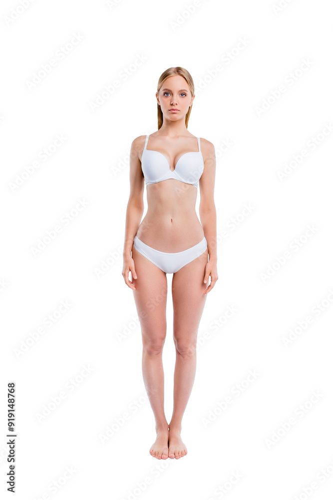 Vertical full length body size portrait of nice attractive adorable charming skinny thin sportive calm perfect healthy girl standing straight isolated over light gray background Vertical full length body size portrait of nice attractive adorable charming skinny thin sportive calm perfect healthy girl standing straight isolated over light gray background