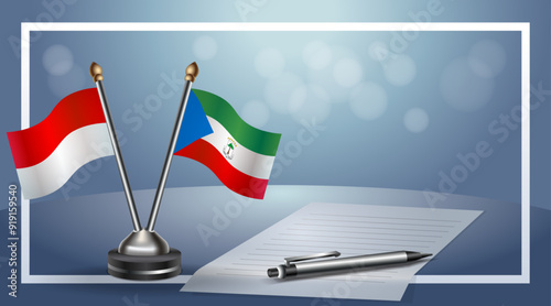 Indonesia and Equatorial Guinea Small national flag on bokeh background, cooperative relationship