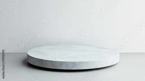 A round pedestal with a solid light grey background, perfect for clean and modern product presentations.