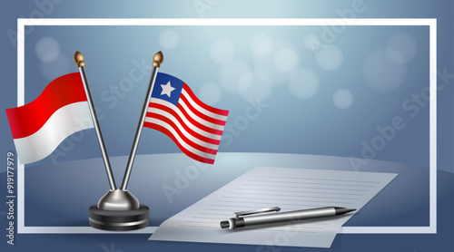 Indonesia and Liberia Small national flag on bokeh background, cooperative relationship