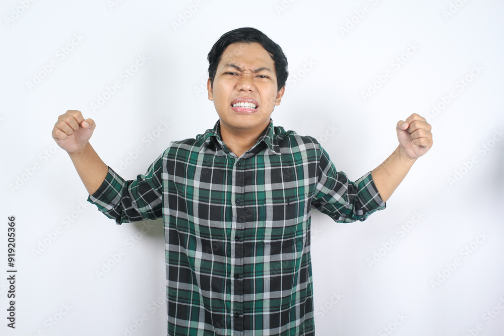 annoyed asian young man raising hand with unhappy expression while facing difficulty isolated white background annoyed asian young man raising hand with unhappy expression while facing difficulty isolated white background