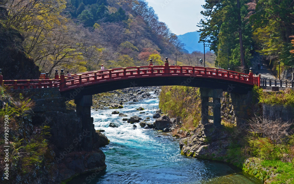 Wonderful landscape of a river crossing behind a shinto style bridge Wonderful landscape of a river crossing behind a shinto style bridge