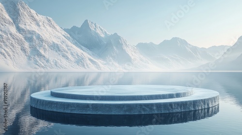 Circular Ice Platform in a Frozen Lake with Snow-Covered Mountains in the Background photo