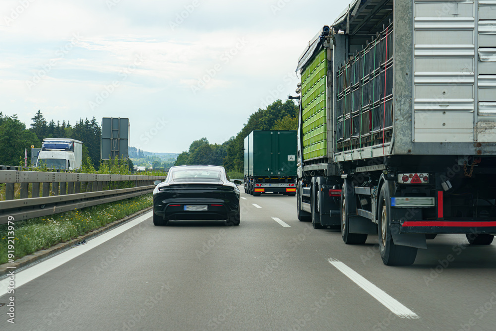 Cars on the motorway travel along a high-speed road. Cars on the motorway travel along a high-speed road.