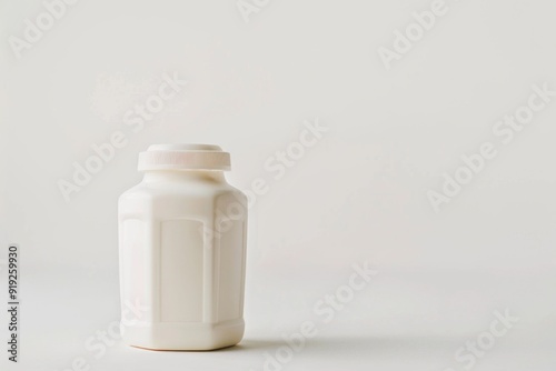 A bottle of milk placed on a clean white surface