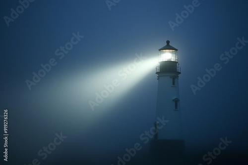 A white lighthouse beam cutting through a dark, foggy night. 