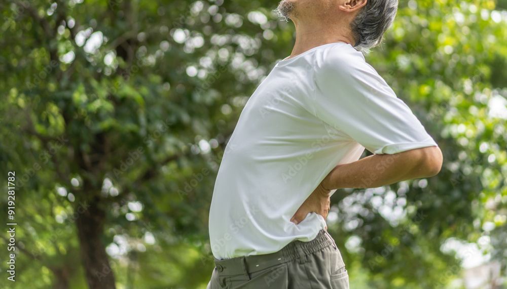 Sick unhappy senior adult elderly man touching her muscle injury Lower back suffering from muscles back pain at home.physical injury and healthcare problem Sick unhappy senior adult elderly man touching her muscle injury Lower back suffering from muscles back pain at home.physical injury and healthcare problem