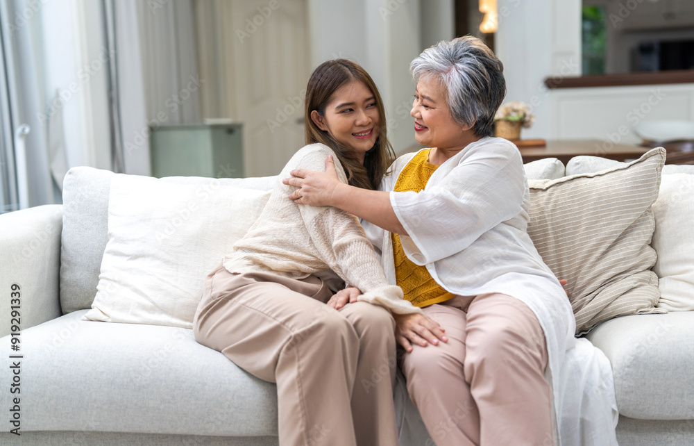 Portrait of enjoy happy love asian family senior mature mother and young daughter smiling play laughing and having fun together at home, care, elderly, insurance.happy family and Mother Day concept Portrait of enjoy happy love asian family senior mature mother and young daughter smiling play laughing and having fun together at home, care, elderly, insurance.happy family and Mother Day concept