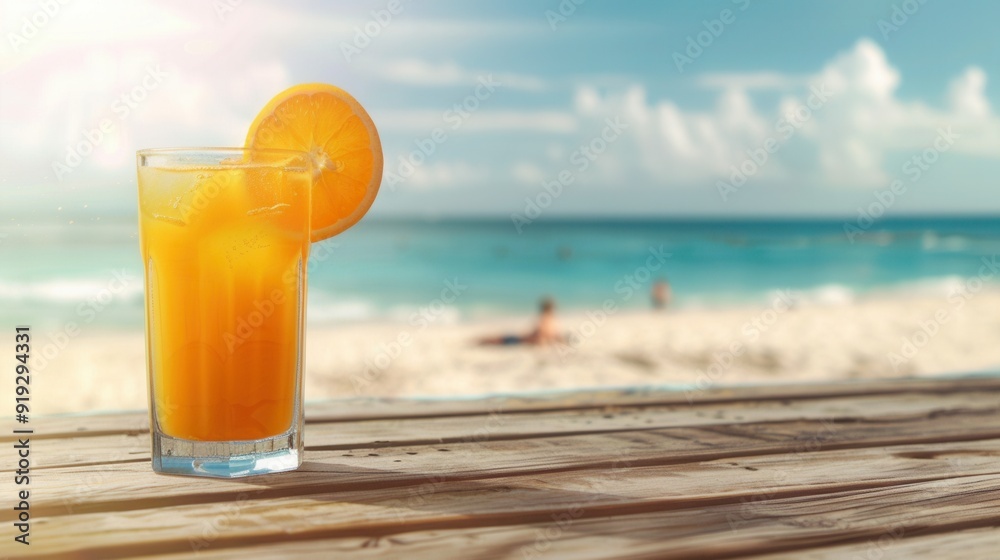 A glass of juice and fresh orange fruit closeup view on table with sandy beach and blue sea A glass of juice and fresh orange fruit closeup view on table with sandy beach and blue sea