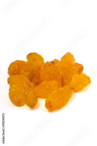 golden raisins isolated on white background. close up.