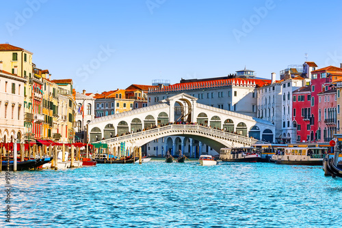 Landscape with  Rialto Bridge and gondola on the Grand Canal in Venice, Italy, Europe.