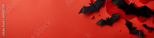 Black bats on a red background with fake blood splatters. Perfect for Halloween decorations.