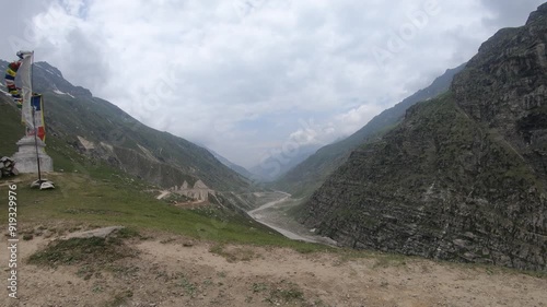 Manal, Himachal Pradesh, India, 06 15 2024: Manali road trip offers breathtaking views, winding paths, and serene landscapes bike rider is enjoying her adventure full Manali hills ride  photo