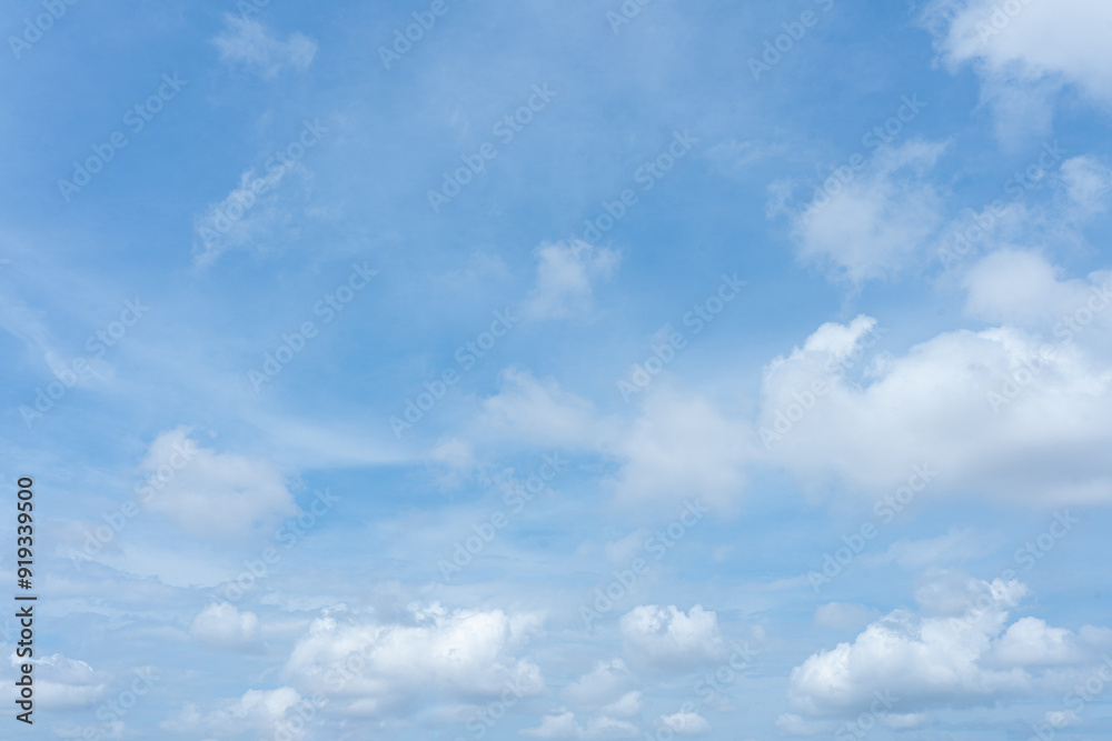 Bright blue sky with fluffy white clouds on a sunny summer day Bright blue sky with fluffy white clouds on a sunny summer day