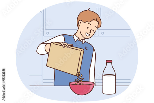 Smiling man eat cereal with milk for breakfast