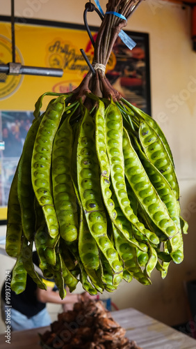 Raw of petai or pete (Parkia speciosa). Usually eaten raw and cooked, popular with name stink bean or bitter bean. Pete plants grow a lot in Indonesia. Indonesia use petai for fresh vegetable, dishes.