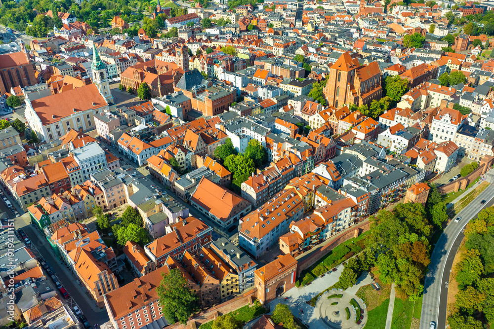 Aerial panoramic view of historical buildings and roofs in Polish medieval town Torun