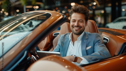 Luxury Car Salesman Sitting in a Convertible at a Showroom Smiling