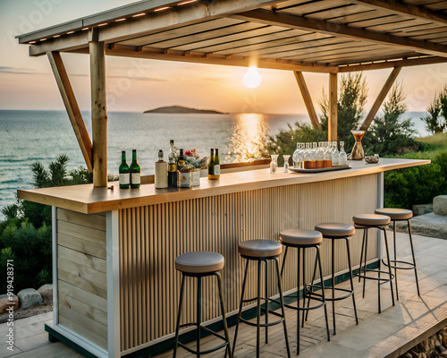 A beautifully crafted wooden bar complete with comfortable stools and an array of bottles of wine set on it, providing a stunning view of the ocean