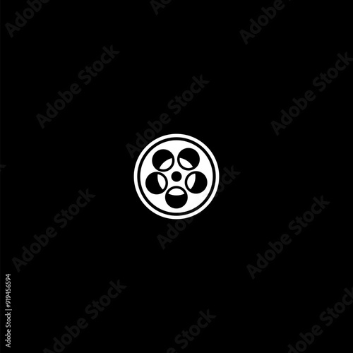 Film reel icon isolated on dark background