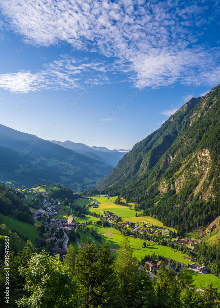 Fototapeta premium Aerial view of the beautiful village Heiligenblut, Austria. Grossglockner mountain landscape with high snowy peaks. Hohe Tauern