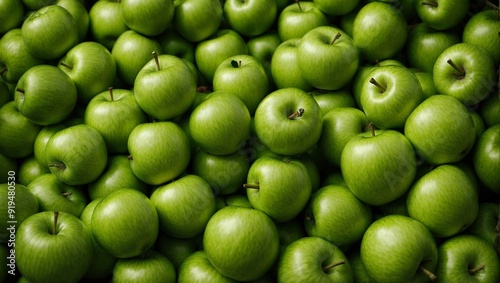 Green Apple Abundance: A vibrant, verdant backdrop of crisp green apples, packed together in a visually captivating display. This image evokes freshness, abundance, and the promise of a healthy harves