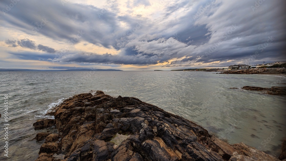 Dramatic cloudy coastal seascape sunset scenery, wild Atlantic way at Salthill beach, Galway, Ireland, nature background