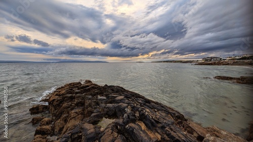 Obraz na płótnie Dramatic cloudy coastal seascape sunset scenery, wild Atlantic way at Salthill beach, Galway, Ireland, nature background w salonie
