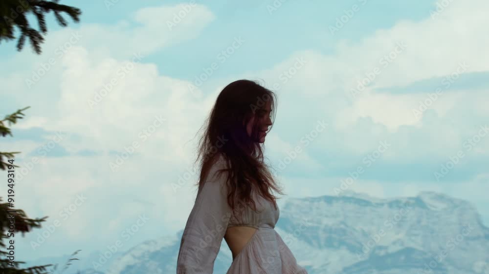 Woman Walking in the mountains with a Bouquet of Wildflowers Woman Walking in the mountains with a Bouquet of Wildflowers