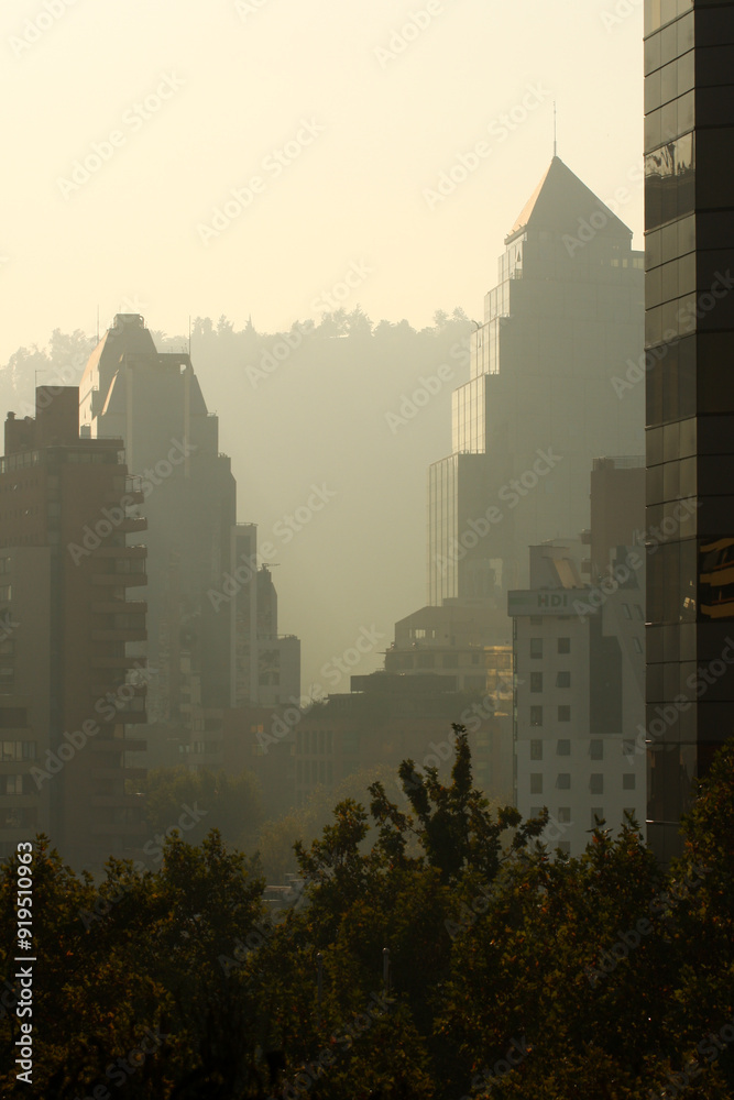 Obraz premium Dramatic view of a skyscraper in the mist in Santiago de Chile