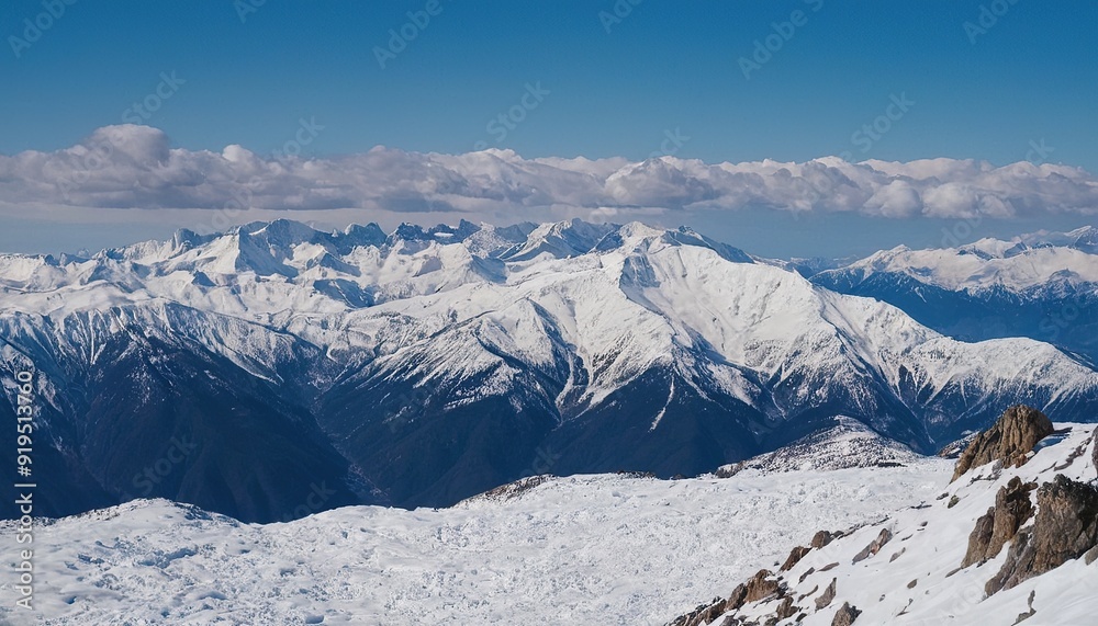 Obraz premium Majestic snowcapped mountains against a blue sky 17