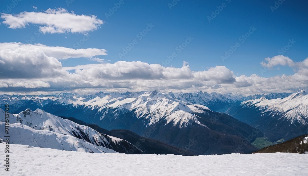 Obraz premium Majestic snowcapped mountains against a blue sky 16