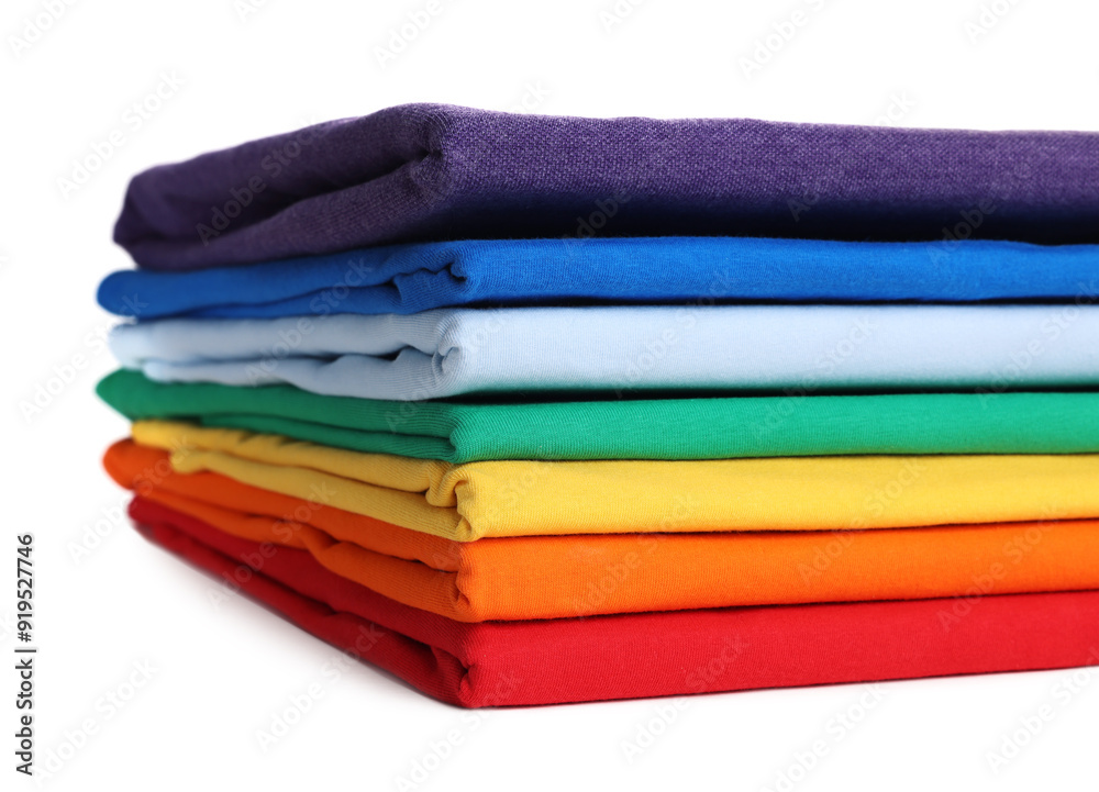 Stack of clean colorful t-shirts isolated on white Stack of clean colorful t-shirts isolated on white