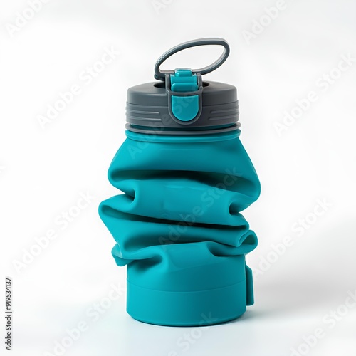 A collapsible blue water bottle with a grey lid and a loop handle, folded for compact storage. photo