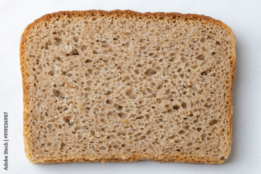 Slices of black bread on a white background, close-up. Slices of black bread on a white background, close-up.