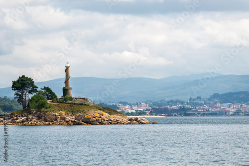 Lighthouse of the Tambo Island as seen from a boat in the Ria de Pontevedra in Galicia, Spain. Formerly a Naval Military School base, since 2022 it serves as a natural and cultural destination.