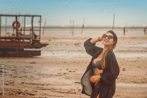 Beautiful brazilan bikini female model brunette smiling at the beach in Sao Miguel dos Milagres, Alagoas photo