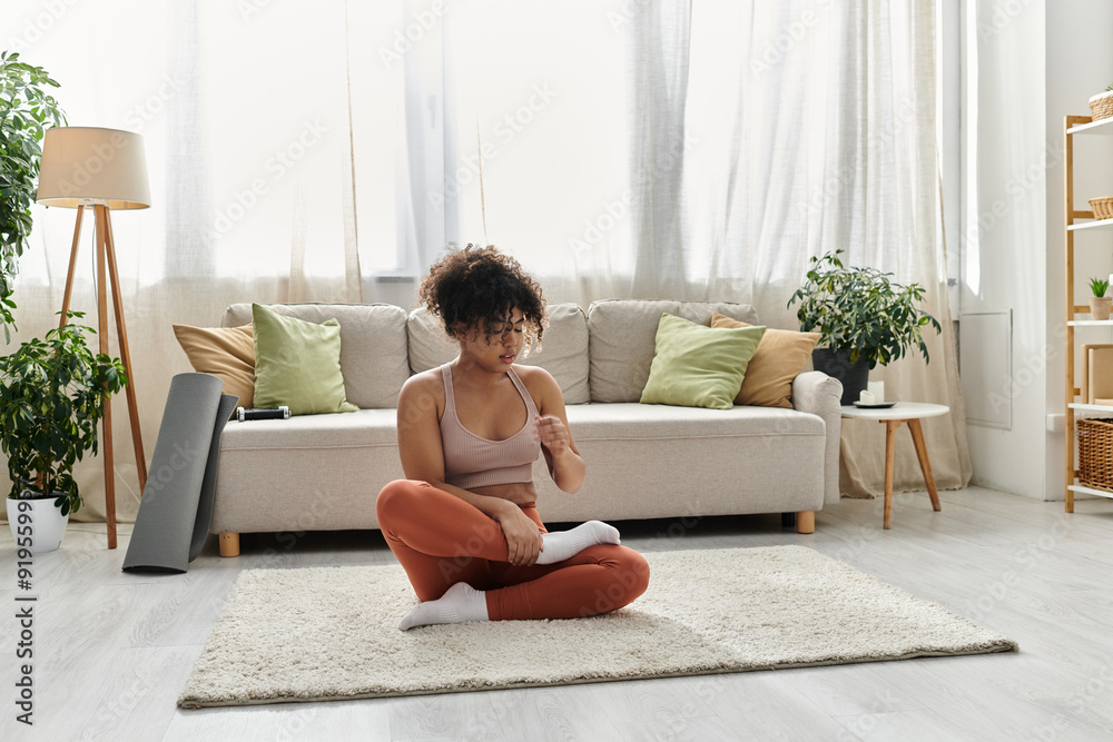 A young woman engages in mindfulness practice in her inviting home space. A young woman engages in mindfulness practice in her inviting home space.