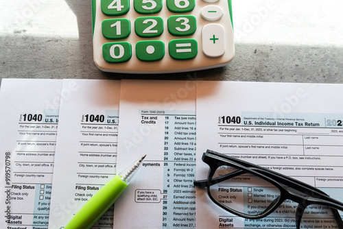  Time to pay taxes concept 1040 tax form pem glasses calculator photo