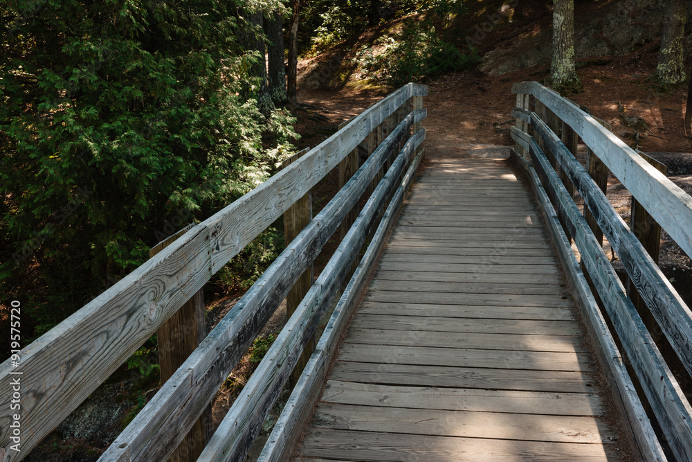 Crossing over the wooden walkway bridge over Pike River at Dave's Falls County Park, Marinette County, Wisconsin Crossing over the wooden walkway bridge over Pike River at Dave's Falls County Park, Marinette County, Wisconsin