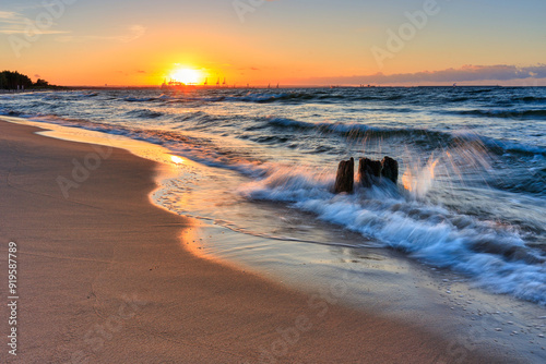 Fototapeta Naklejka Na Ścianę i Meble -  Sunset over the Baltic Sea beach in Gorki Zachodnie, Gdansk. Poland