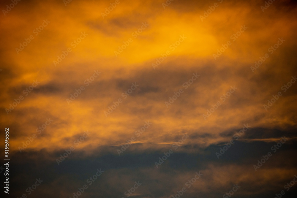 Obraz premium Abstract image created by the setting sun and clouds