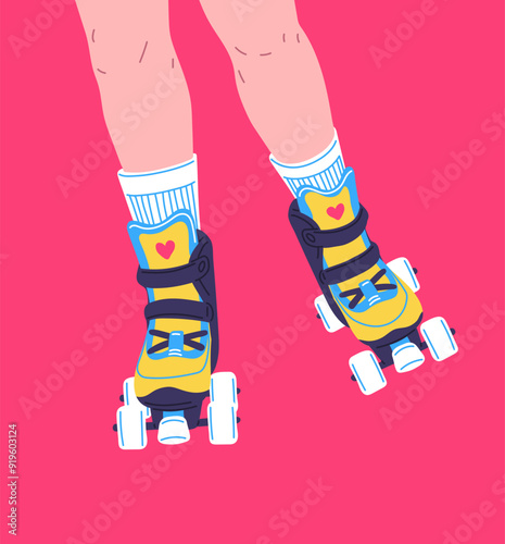 Female legs on yellow roller skates with a bright pink isolated background.