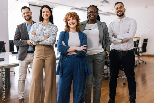 Quadro em tela Portrait of young CEO businesswoman standing  with her hands crossed in front of her colleagues