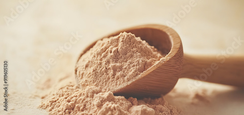 Close-up of Protein Powder on Beige Background