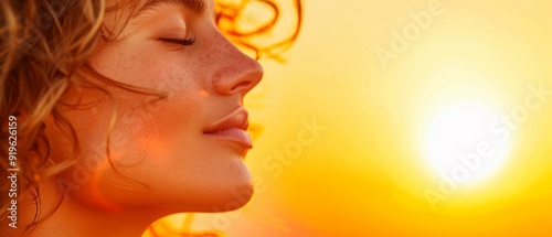  A woman's face, sharply focused Sun rays glinting from behind, hair billowing in the wind