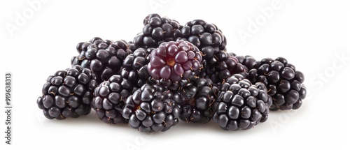  A stack of blackberries on a white table, arranged next to one another