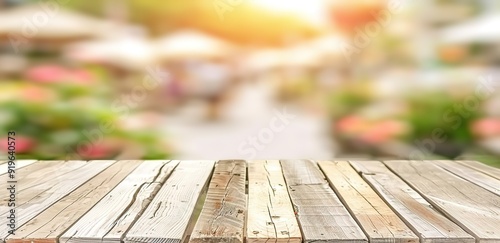Wooden table top with blurred background of a busy outdoor market. Perfect for showcasing products or creating a rustic ambiance.