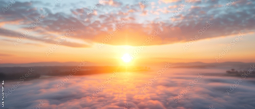 Sun sets over clouds in the sky, casting a reflection on a body of water A boat is visible in the distance Sun sets over clouds in the sky, casting a reflection on a body of water A boat is visible in the distance